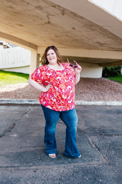 Plus size woman models flare jeans