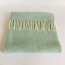 Load image into Gallery viewer, Rory &amp; Ruby pure new wool baby pram blanket in ocean aqua with cream woollen tassel fringe and blanket stitch edging.