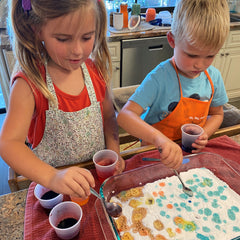 Young girl and boy baking soda and vinegar activity