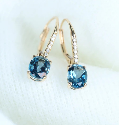Blue topaz and diamond earrings in gold