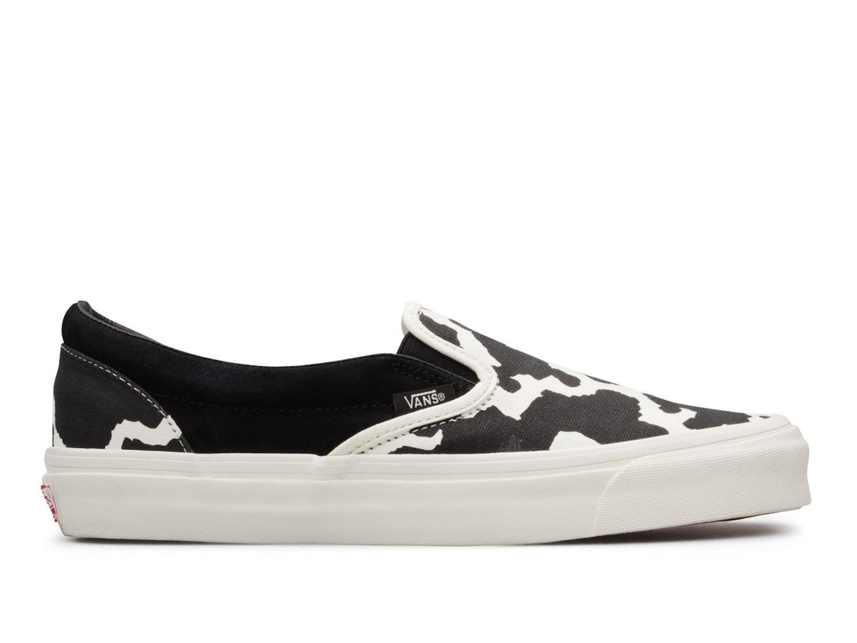 vans slip on cow