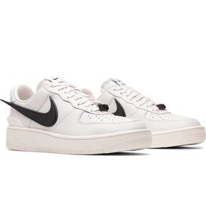 white air forces with black check mark
