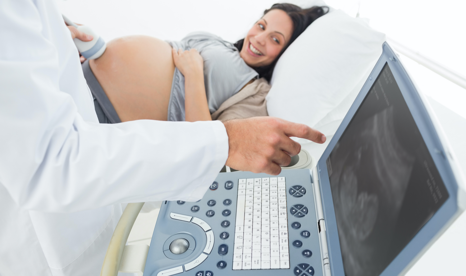 Doctor using portable ultrasound machine