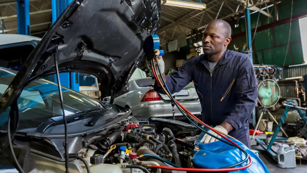 Mechanic checking car
