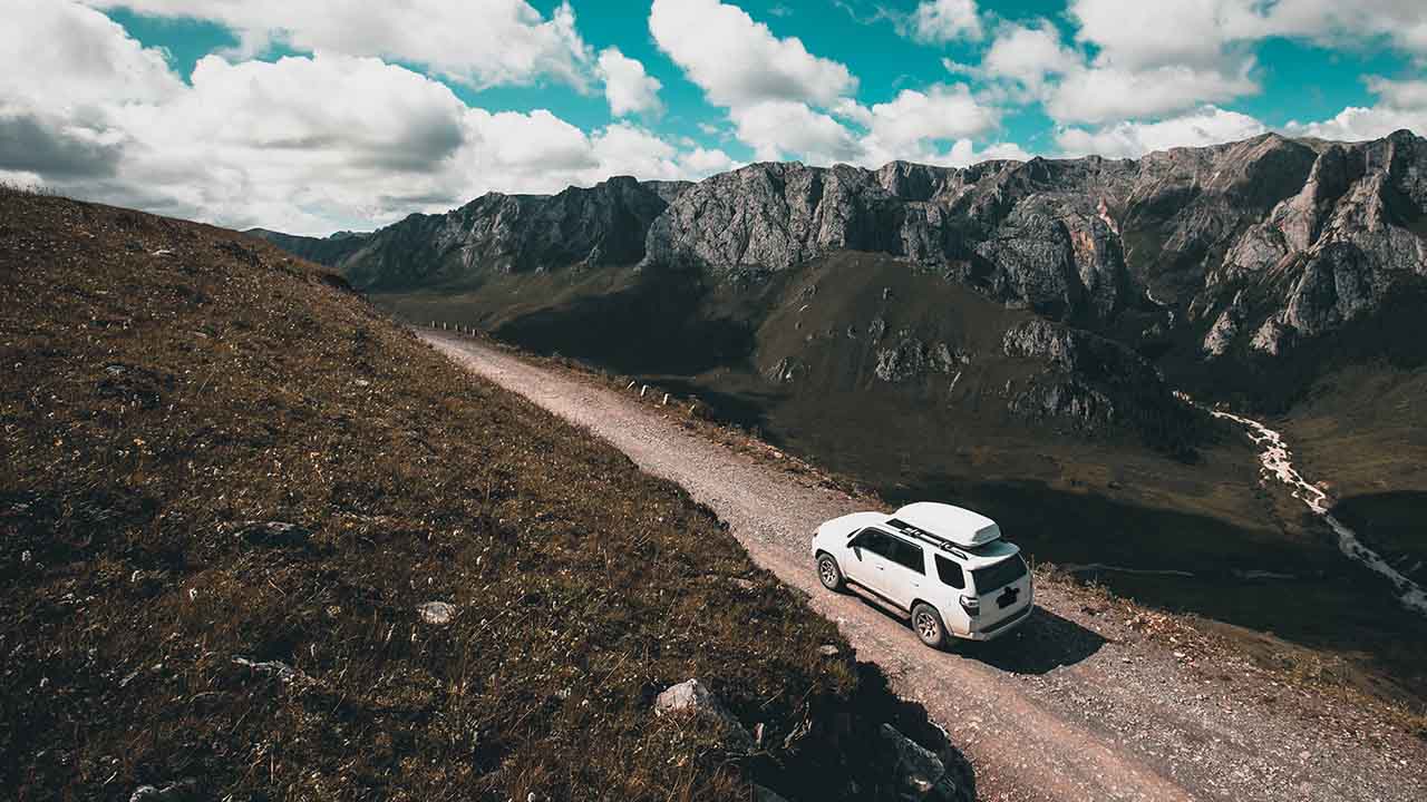 driving-off-road-car-on-high-altitude-mountain-top