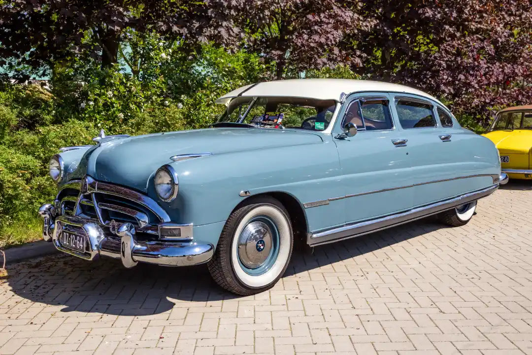 A restored Hudson classic car in blue