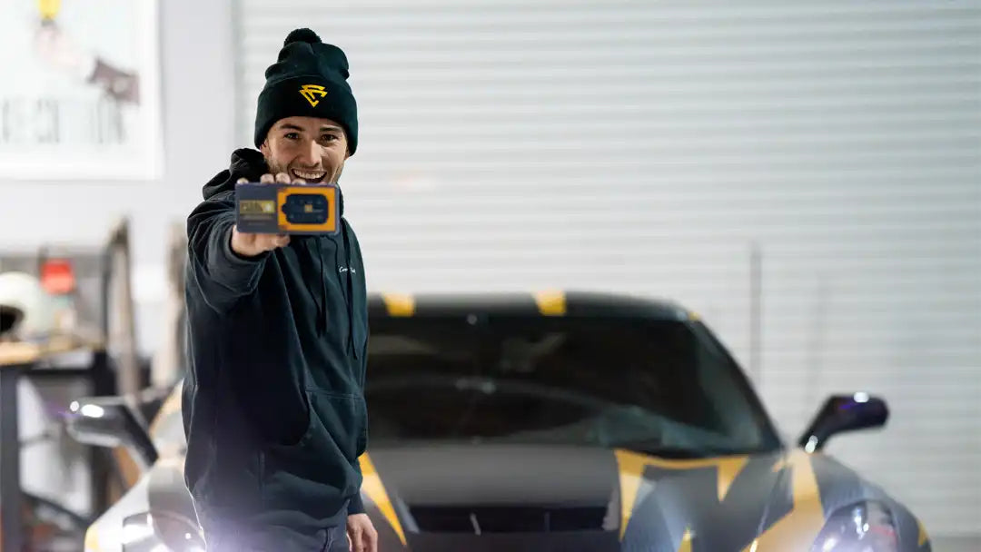Corey Funk holding a Pedal Commander®