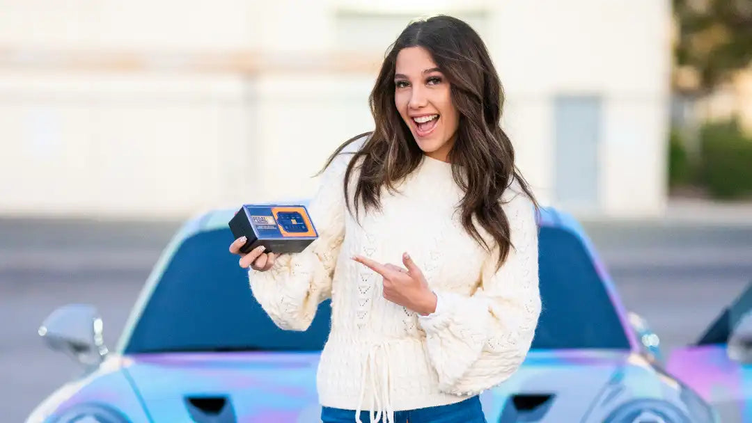 Automobile Influencer Gigi Holding a Pedal Commander®