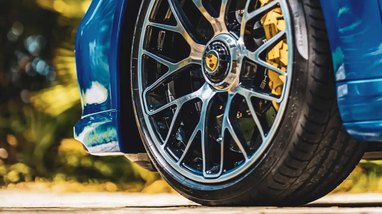 A car with aftermarket wheels and tires