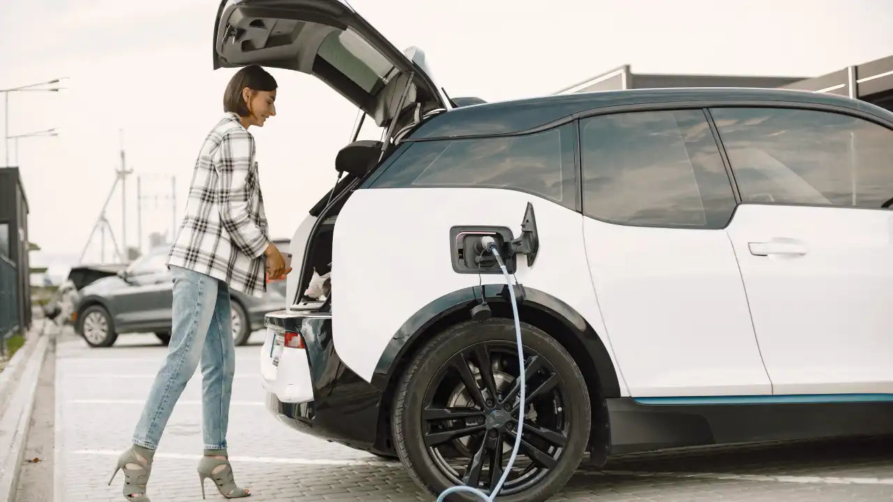 woman and electric car