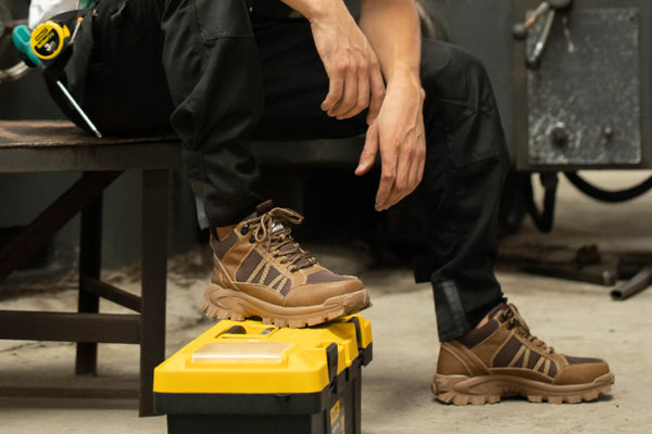 Tradesperson wearing Indestructible Shoes on a worksite.