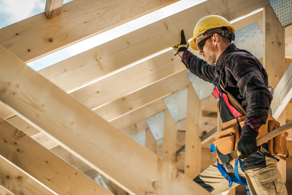 Construction worker actively performing duties on the job site, ensuring progress and safety