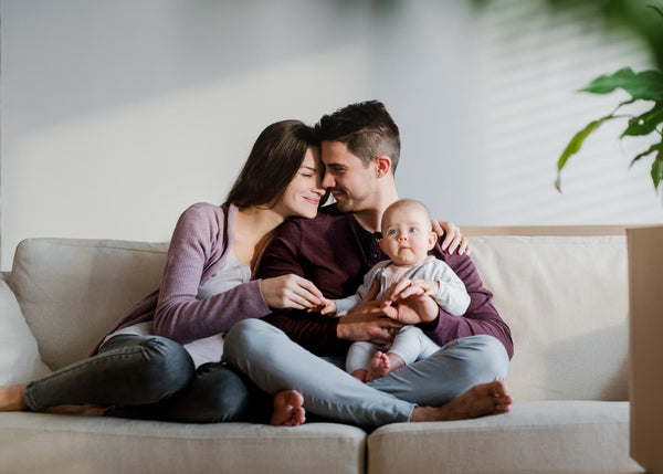 Parents are holding their baby.