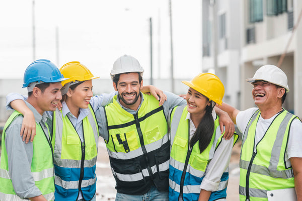 A team of construction workers looking happy.