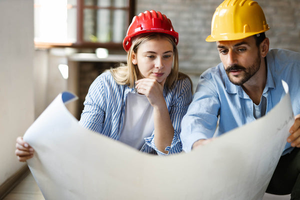 Young couple reviewing housing plans