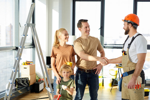 Family greeting a handyman