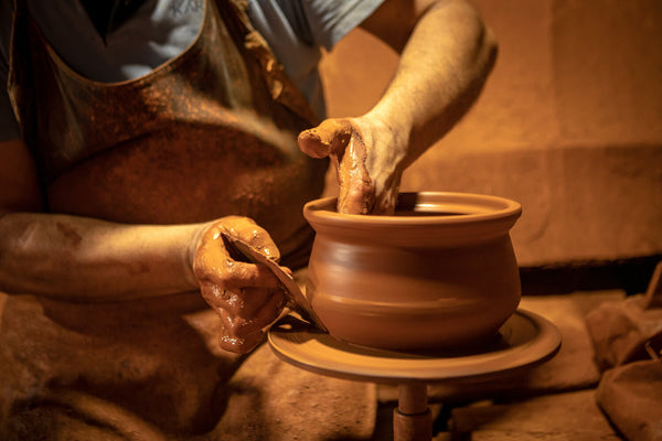 A man crafting pottery