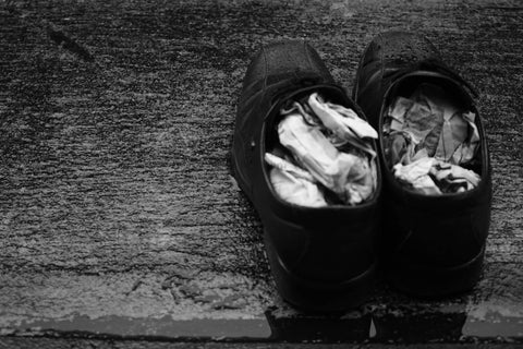 Shoes with newspaper stuffed inside to maintain shape