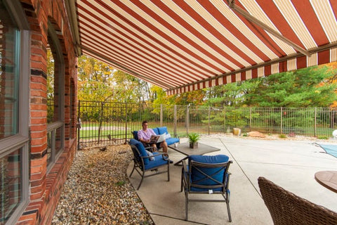 Man Reading in Chair under Extended Patio Awning