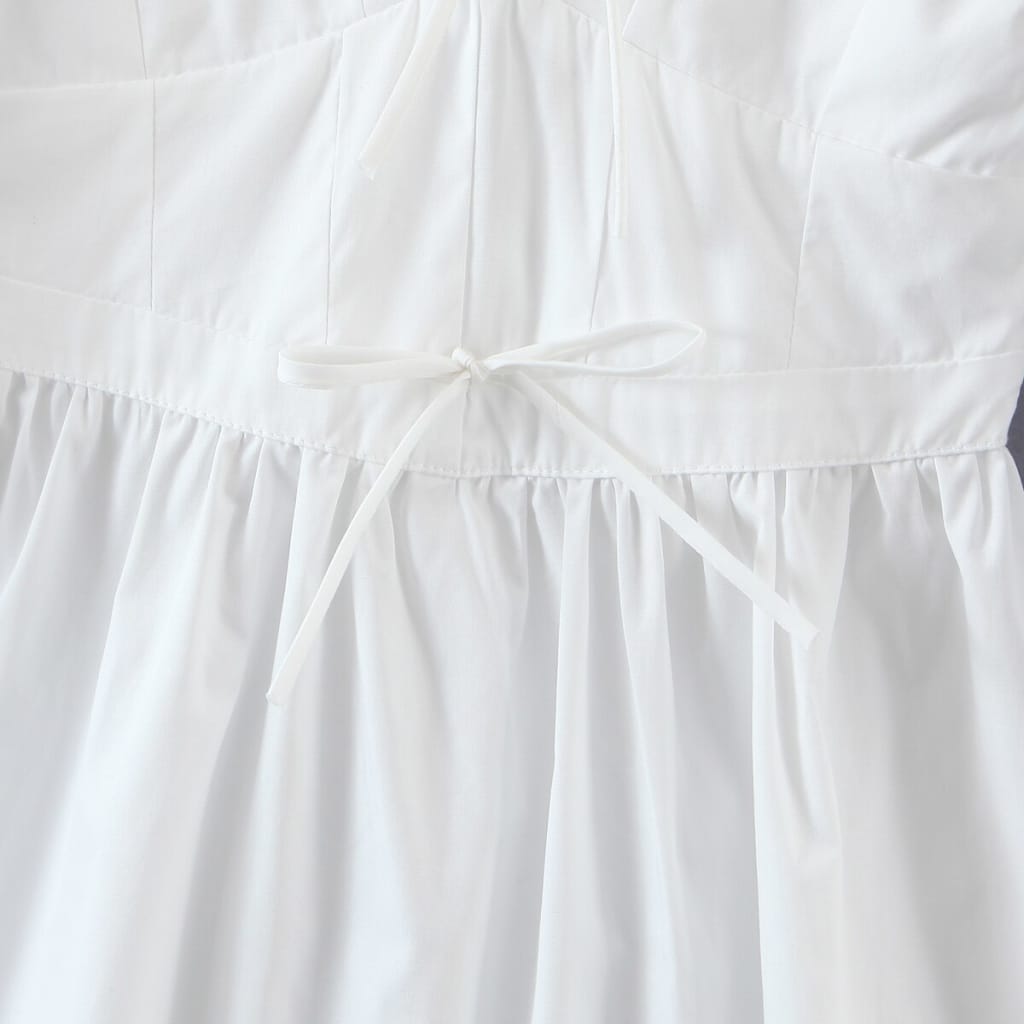 Solid White Short Puff Sleeve Mini Dress with Bow Tie detail in Center and across the Chest