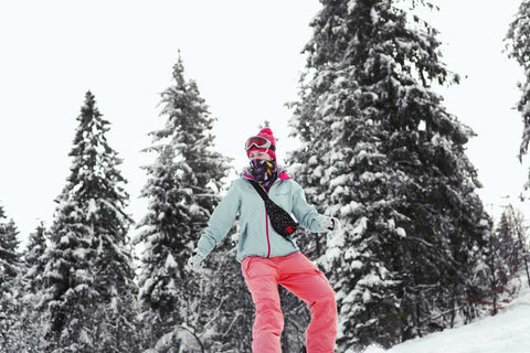 woman-wearing-sun-protective-cloth-legging-and-upf-protective-face-mask-skiing-winter