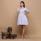 Front View of a Model wearing Powder Blue Ikat Elasticated Gathered Dress