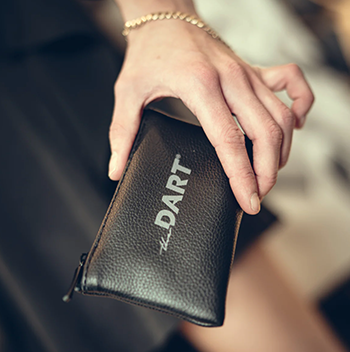 A person using a combination lock to secure their smell proof bag