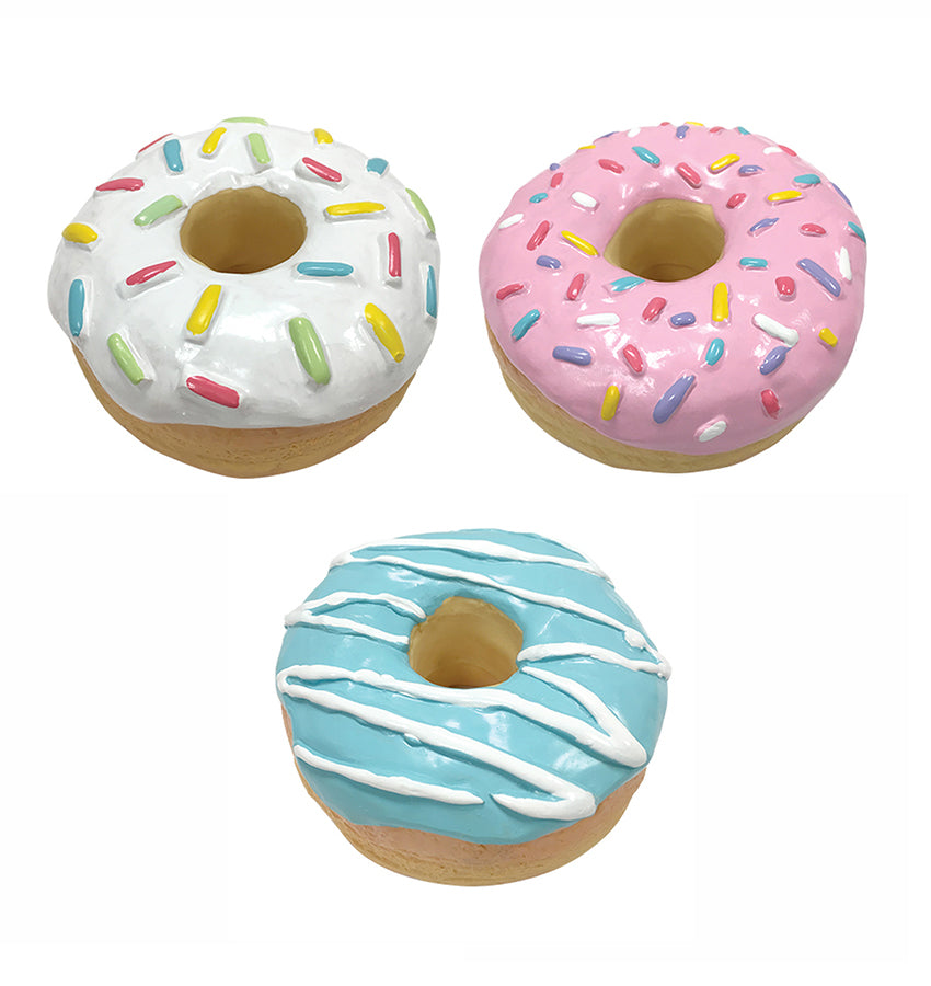 A group of the 3 donut chew toys that Little Chief and Co sells. Pink, Blue, and White.