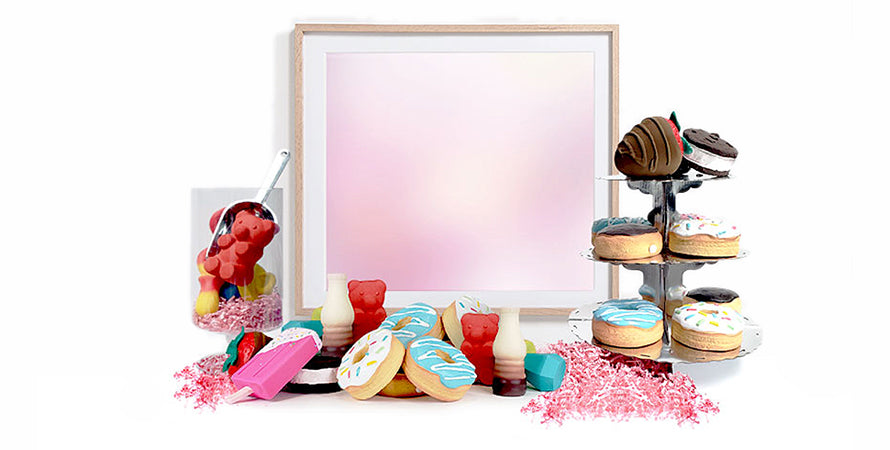 A staged setup of donut squeak toys on a table like its soon to be a party of guests