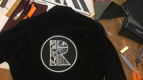 Black vintage reworked jacket with Rhetorik logo on back