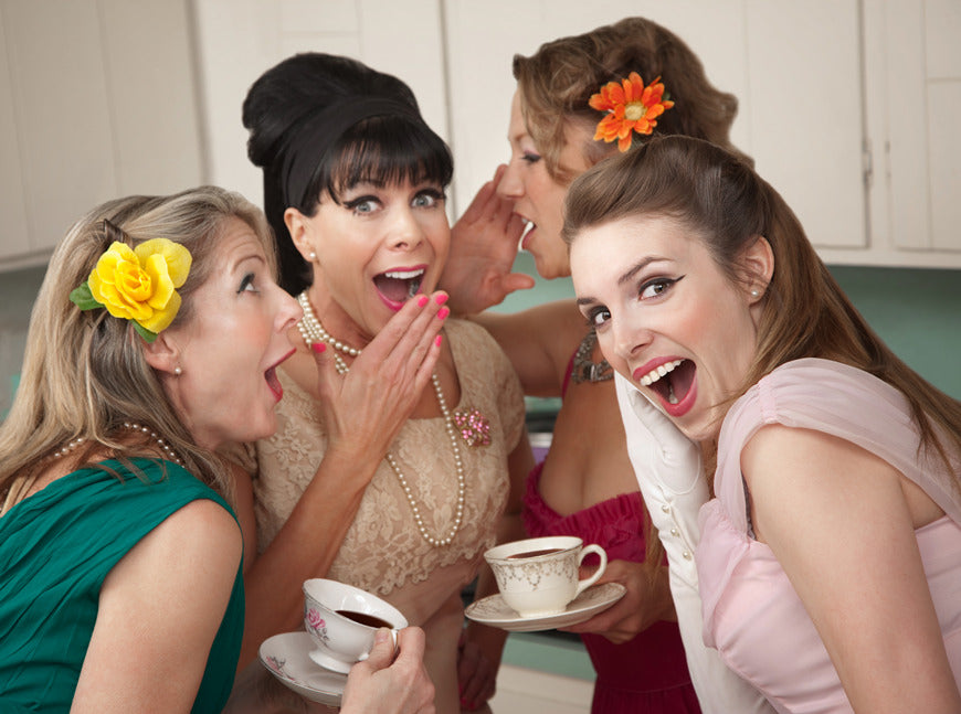 Group-of-four-retro-fashion-housewives-tell-secrets-in-the-kitchen