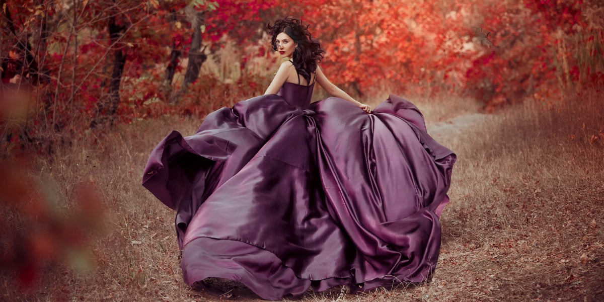 Portrait of lady in luxurious lush purple dress, fantastic shot of fairytale princess walking in autumn forest, stylish tones, creative computer colors. Fashion queen. Mangrove October.