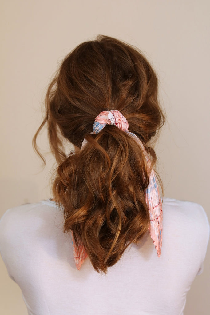 Tie a scarf on a ponytail