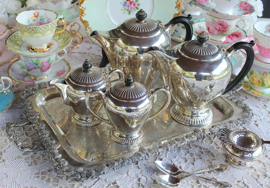 Vintage-antique-silver-tea-set-on-a-tray-with-tea-cups-and-saucers-high-tea-party