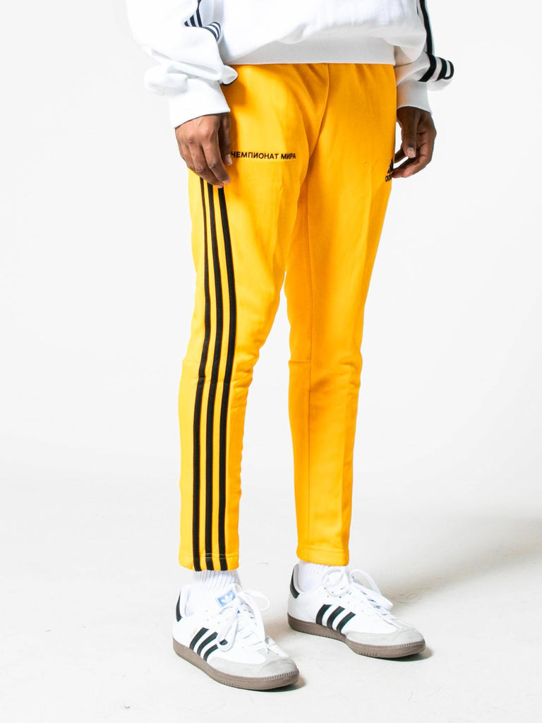 black and yellow adidas track pants