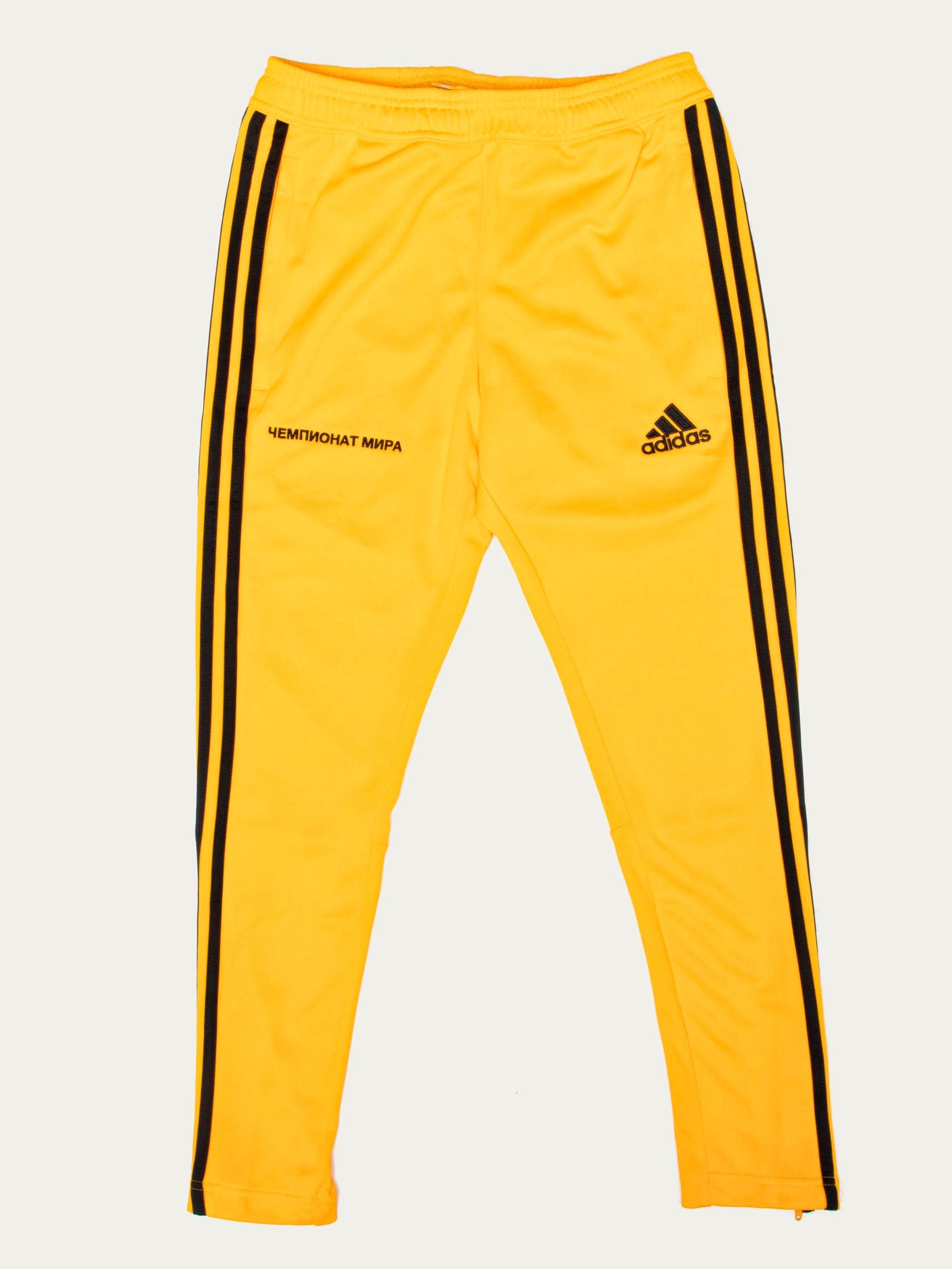 black and yellow adidas track pants