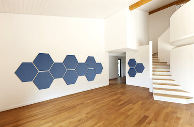 Hexagon acoustic panels mounted on a wall