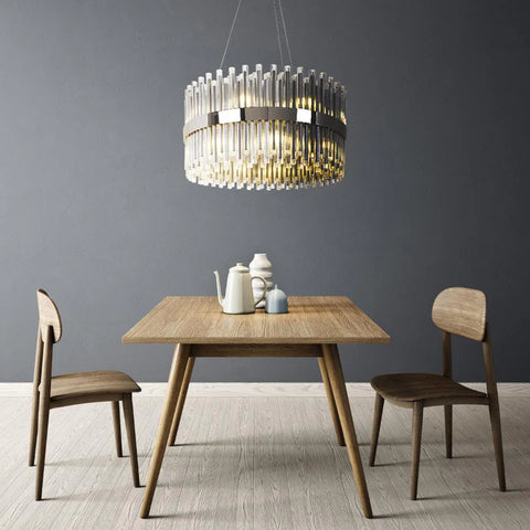 Chandelier above a wooden dining room table