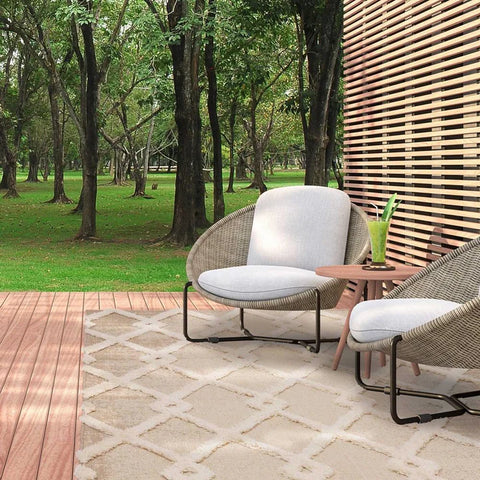Beige outdoor rug with large diamond pattern in lighter colour