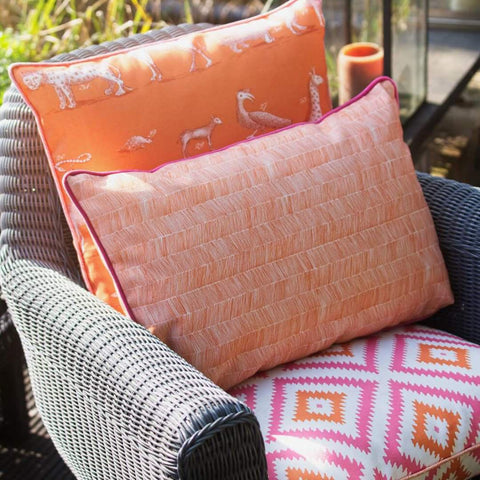 Peach outdoor cushion on an armchair