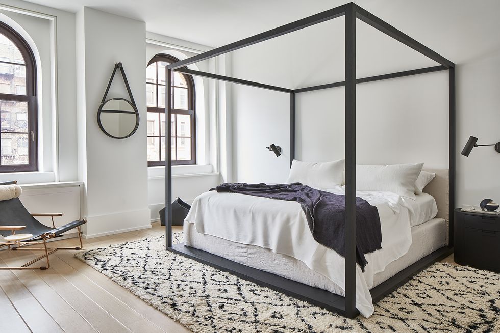 serene bedroom with 4 poster bed