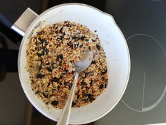 Suet and seeds melted in pan on hob