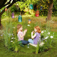 Girls playing in a garden fairy ring
