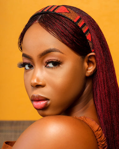 A Sierra Leonean Top Model rocking a wig and headband from Femafric