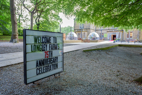 Welcome to Longley Farm's 75th Anniversary Celebration sign, on entrance to the Venue Storthes Hall, 2023