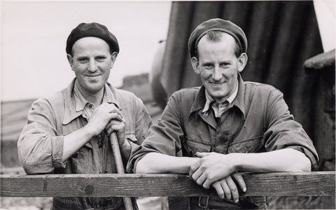 Joseph (left) and Edgar (right) Dickinson in front of the grass dryer, 1954