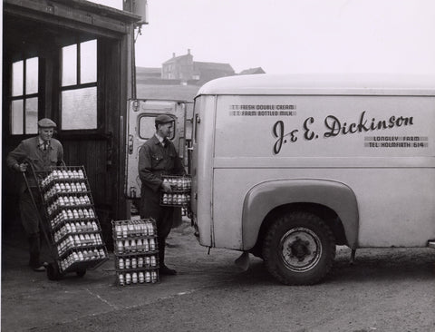 Founders Joseph (left) & Edgar (right) Dickinson loading bottles of cream onto a delivery van, at Upper Longley Farm in 1960.