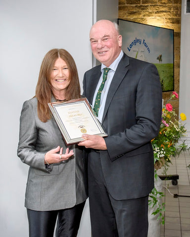 Joanne Bedford receives long service award from Jimmy Dickinson