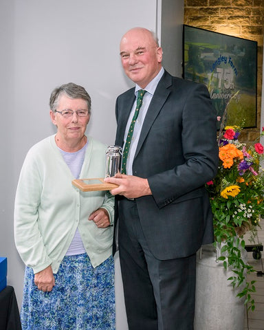 Megan Dawson receives long service award from Jimmy Dickinson