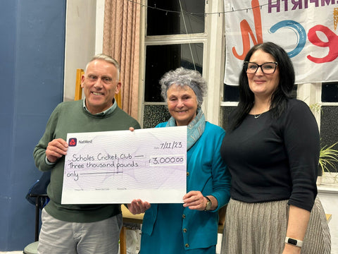 John Andrews receives cheque from Greta Bradley of the BGCT and Emma Woods-Bolger of One Community